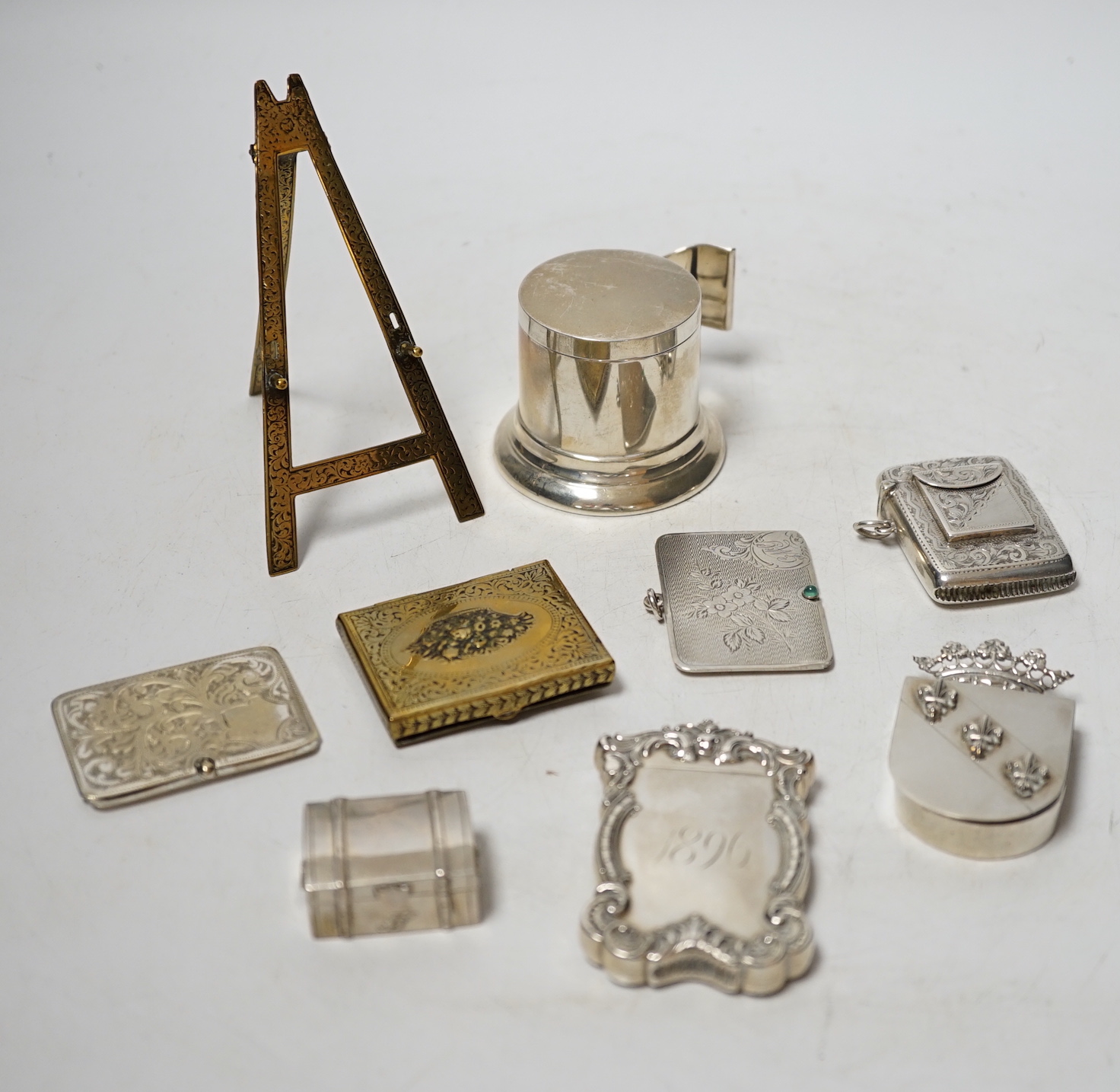 An Edwardian engraved silver combination stamp box/vesta case, Birmingham, 1906, 48mm, a similar silver slide action stamp case and seven other items including white metal box and sterling dispenser, etc.